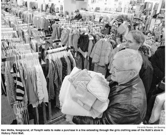 Line extending through the girls' clothing area